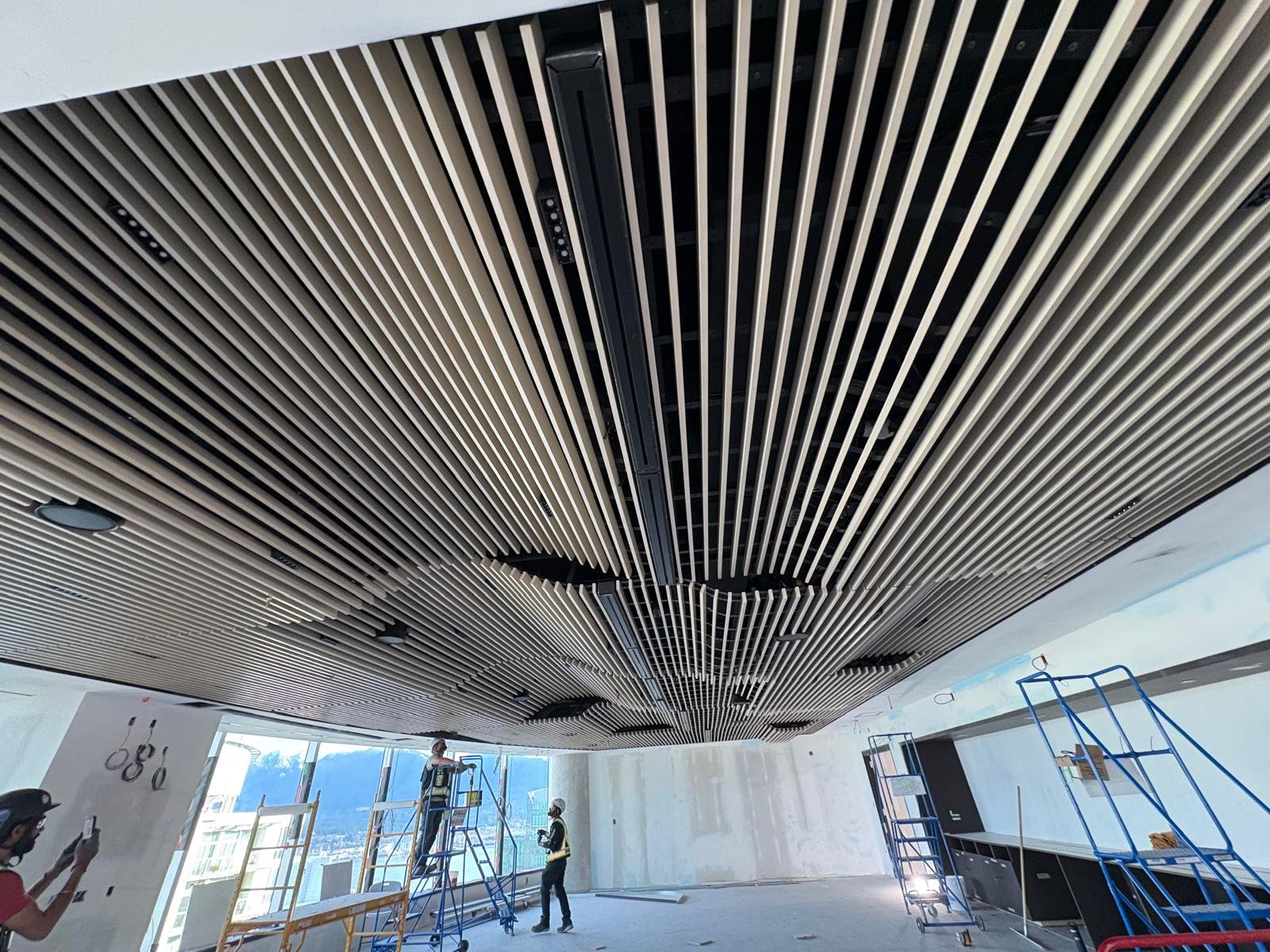Embark Interior Ltd – Acoustic wood slat ceiling installation by skilled craftsmen