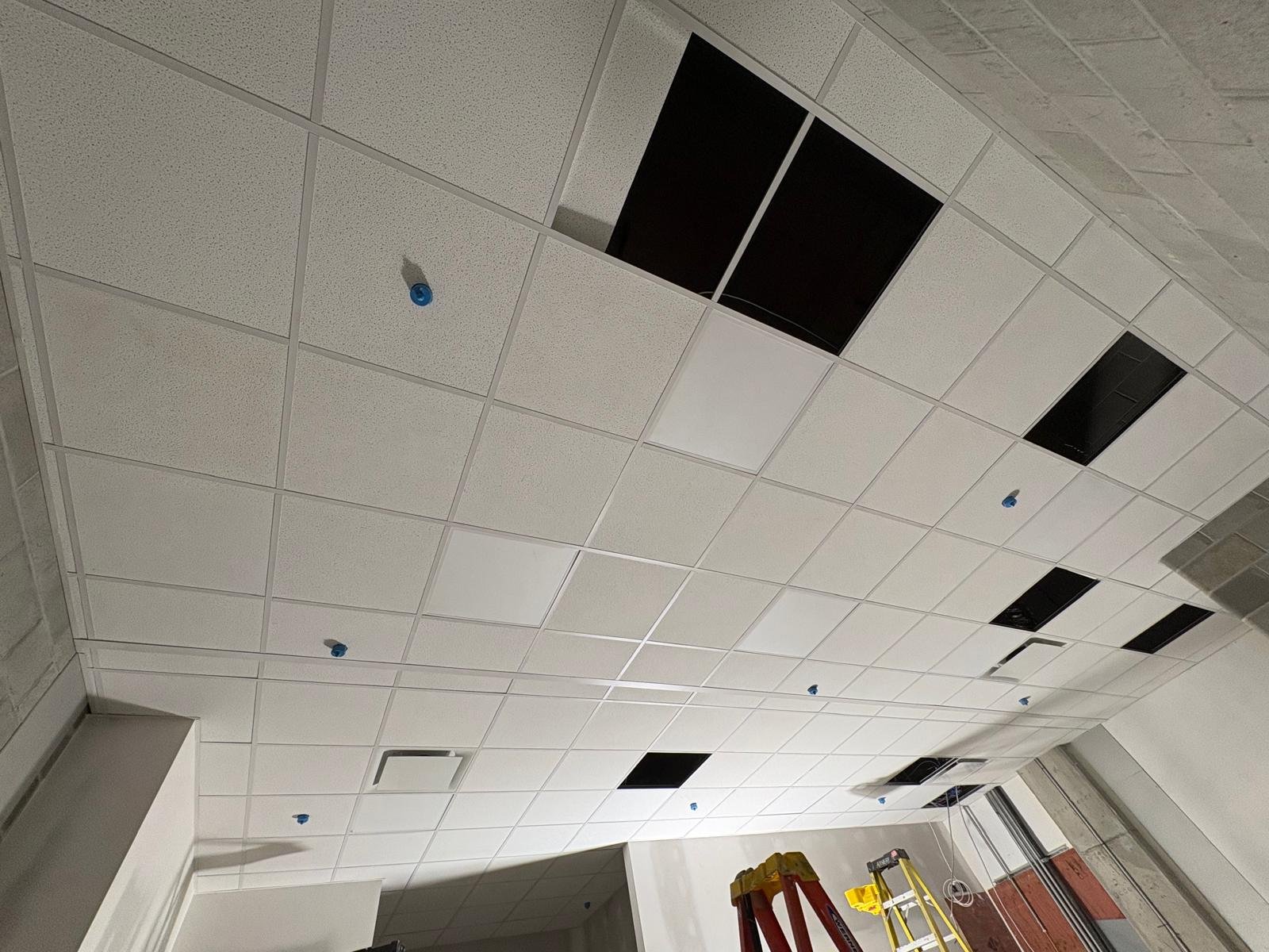 Suspended T-bar ceiling tile installation